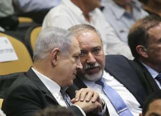 Knesset passes law authorizing prime minister and defense minister to declare war File photo: Israeli prime minister Benjamin Netanyahu and Defense Minister Avigdor Liberman attend the graduation ceremony at the National Security College on July 13, 2016. Photo by FLASH90
