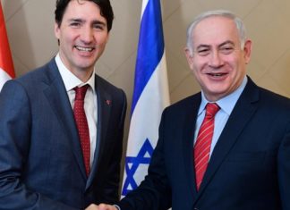 Minister lauds groundbreaking free trade deal between Israel, Canada Israeli Prime Minister Benjamin Netanyahu with Canadian Prime Minister Justin Trudeau in Davos, Switzerland, on Jan. 24, 2018. Photo by Amos Ben Gershom/GPO.