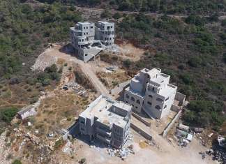 Knesset advances regulations imposing fines on illegal housing construction Illegal construction, taken in the Misgav region of the Galilee. Photo credit: Regavim