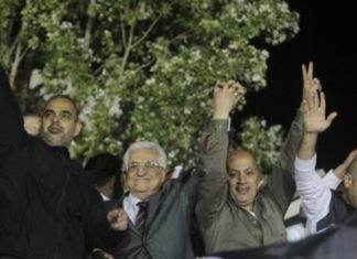 Lawmakers back tougher version of terrorist wages bill Palestinian Authority President Mahmoud Abbas (second from left) waves with released Palestinian prisoners coming from Israeli jails during celebrations at Abbas's headquarters in Ramallah, October 30, 2013. Abbas at the celebration called freed terrorist prisoners "heroes," Palestinian Media Watch reported at the time. Credit: Issam Rimawi/FLASH90.