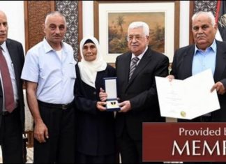 Abbas: ‘If we had only a penny left, we would pay martyrs, prisoner families’ Palestinian Authority leader Mahmoud Abbas confers a medal on the family of a “martyred prisoner.” (Source Pnn.ps, July 23, 2018: MEMRI)