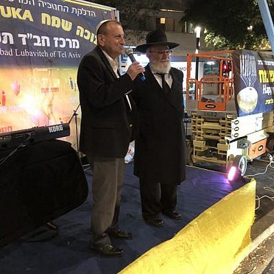 Mayor of Tel Aviv-Yafo Ron Huldai inaugurated the renewed Dizengoff Square in Tel Aviv by lighting the fourth Chanukah candle of the central Chabad Chanukah Menorah together with Rabbi Joseph Gerlitzky,