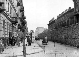UN ambassadors visit Poland, Israel as part of Holocaust-remembrance program The view on Grzybowska Street from the gate at Żelazna Street, looking eat from the Polish side into the Warsaw ghetto, June 1942. Credit: German Federal Archives.