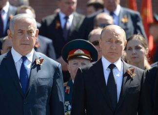 Amid right-wing party merger efforts, Netanyahu postpones trip to Moscow Israeli Prime Minister Benjamin Netanyahu, left, and Russian President Vladimir Putin seen during a wreath-laying ceremony at the Tomb of the Unknown Soldier in Moscow, on May 9, 2018. Credit: Amos Ben Gershom/GPO.