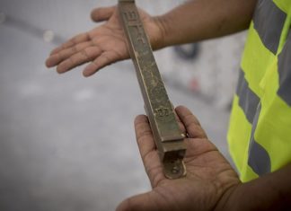 ‘Mezuzah Week’: A spiritual revolution in Tel Aviv A man holds a “mezuzah” at the site of the new National Memorial Hall at the entrance to the military cemetery on Mount Herzl in Jerusalem on April 27, 2017. Photo by Yonatan Sindel/Flash90.