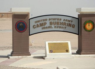 A combat officer’s Passover in the sands of Kuwait Entry sign at U.S. Camp Buehring, Kuwait. Credit: Wikimedia Commons.