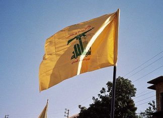 Kosovo designates Hezbollah in its entirety as terror group The Hezbollah flag. Credit: Wikimedia Commons.