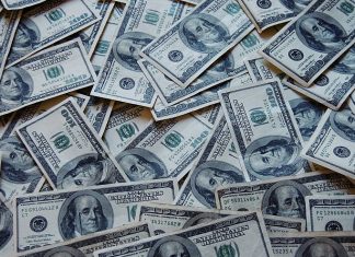 US Treasury sanctions bank with aiding Hezbollah, and suspects for moving millions between Iran and Hamas U.S. $100 bills. Credit: Wikimedia Commons.