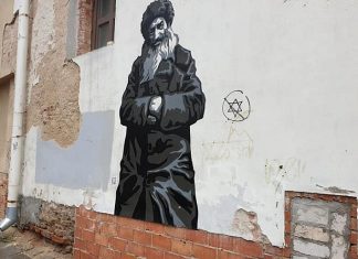 Anti-Semitic graffiti spray-painted on project commemorating Jewish life in Lithuania Anti-Semitic graffiti found on a wall mural commemorating Jewish life in Vilnius, Lithuania. Source: Facebook.