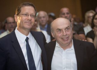 Natan Sharansky is awarded 2020 Genesis Prize Incoming Jewish Agency chairman Isaac Herzog with outgoing chairman Natan Sharansky at the board of governors conference of the Jewish Agency at the Orient Hotel in Jerusalem on June 24, 2018. Photo by Hadas Parush/Flash90.