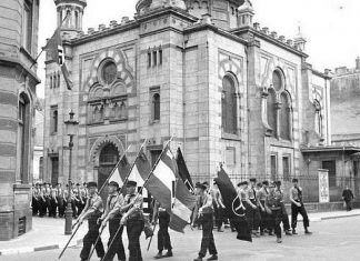 Luxembourg to compensate Holocaust victims A Nazi parade by the synagogue in Luxembourg in 1941, which was destroyed in 1943. Credit: Wikipedia.