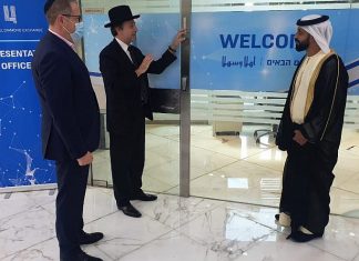Rabbi, cantor hang mezuzah at Israel Diamond Exchange office in Dubai Helping affix a mezuzah at the Israel Diamond Exchange in Dubai’s Multi Commodities Centre (DMCC) are (from left): Alex Peterfreund, co-founder and cantor of the Jewish Council of the Emirates (JCE); Rabbi Dr. Elie Abadie, senior rabbi of the JCE; and Ahmed Bin Sulayem, executive chairman of the DMCC, Jan. 28, 2021.
