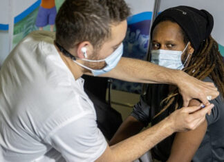 Israeli Health Minister: More than half the population fully vaccinated A COVID-19 vaccine is administered at a vaccination center in Jerusalem on March 11, 2021. Photo by Yonatan Sindel/Flash90.