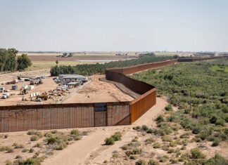 Why is HIAS seeking to make America’s border crisis even worse? Construction on the new border wall system project near Yuma, Ariz., June 3, 2020. Credit: Jerry Glaser, U.S. Government Photo via Wikimedia Commons.