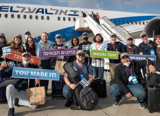 Israel welcomes 104 new immigrants from North America Israeli Aliyah and Integration Minister Pnina Tamano-Shata (back row, seventh from the right) welcomes new immigrants from North America at Ben-Gurion International Airport, April 26, 2021. Credit: Nefesh B'Nefesh.