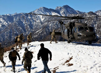 Does America’s Afghanistan pullout bode ill for Israel? U.S. and Afghan National Army soldiers board a U.S. Army UH-60 Black Hawk helicopter at Observation Post Mangol in the Nari district, Kunar province in Afghanistan, on Feb. 8, 2012. Credit: Sgt. Trey Harvey, Joint Combat Camera Afghanistan, U.S. Department of Defense via Wikimedia Commons.