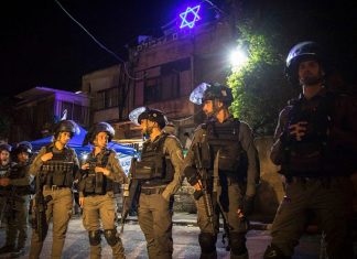 Can Israeli restraint keep the peace in Jerusalem? Israeli border police stand guard by a house of a Jewish family during a protest against Israel's plan to demolish some houses of Palestinians in the eastern Jerusalem neighborhood of Sheikh Jarrah, May 6, 2021. Photo by Olivier Fitoussi/Flash90.
