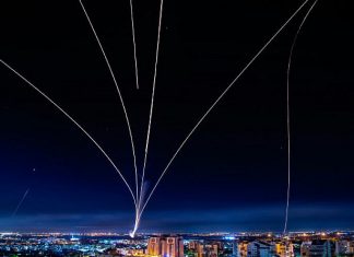 IDF demolishes building used by Hamas, media agencies A long-exposure shot showing Israel's Iron Dome defense system firing interceptors at rockets fired from the Gaza Strip, May 16, 2021. Photo by Avi Roccah/Flash90.
