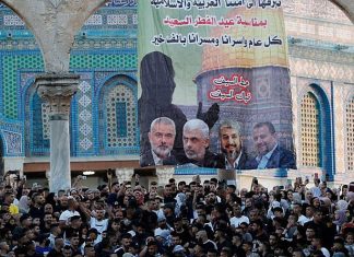 Pro-Hamas signs appear on Temple Mount as thousands arrive for Eid prayers A pro-Hamas poster featuring the heads the terror organization, in front of the Dome of the Rock in Jerusalem, on May 13, 2021. Credit: Israel Hayom.
