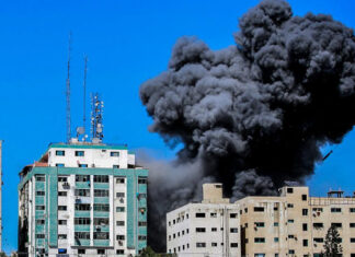 Erdan tells ‘AP’: Hamas used Gaza media tower to jam Iron Dome system Smoke rising from the Al-Jalaa tower in Gaza City after an Israeli airstrike, which according to the Israel Defense Forces housed Hamas intelligence and weaponry, in the midst of a conflict with Israel. Several media outlets also had offices in the building, including the Associated Press and Al Jazeera, May 15, 2021. Photo by Atia Mohammed/Flash90.