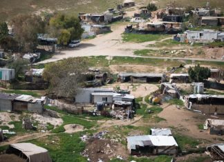 Lapid calls for Khan al-Ahmar evacuation delay, warns of potential political consequences The illegal Bedouin village Khan al-Ahmar, east of Jerusalem. March 21, 2021. Photo by Yonatan Sindel/Flash90.