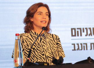 Israel joins world’s carbon-free bandwagon, but some wonder if it makes economic and scientific sense Minister of Environmental Protection Tamar Zandberg speaks during a Conference of Heads of Local Authorities, in Ramat Negev, southern Israel, July 22, 2021. Photo by Flash90