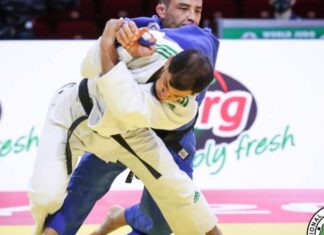 Algerian judoka gets 10-year ban for refusing to compete against Israeli in Tokyo Algerian judoka Fethi Nourine (blue) competing in 2021. Credit: International Judo Federation.