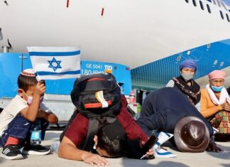 Bnei Menashe group of 235 from India lands at Ben-Gurion on Yom HaAliyah A total of 235 new immigrants from the Bnei Menashe community in India landed in Israel on Oct. 13, 2021. Credit: Laura Ben David, courtesy of Shavei Israel.
