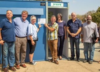 ICEJ orders 30 more bomb shelters for Israeli towns on Lebanon border Members associated with the International Christian Embassy Jerusalem near a donated bomb shelter in Kibbutz Magan in southern Israel. Credit: ICEJ.