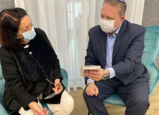 Jewish Agency, WZO launch Holocaust-remembrance social-media campaign Acting Jewish Agency chairman Yaakov Hagoel with Holocaust survivor Mariah Krupievsky, whose father, Israel Nissman, was murdered by the Nazis in 1941 when they lived in Chernivtsi. In the picture, Hagoel uploaded his name to an Instagram story as part of the Jewish Agency and World Zionist Organization’s "Forever in their Name" campaign. Credit: Jewish Agency for Israel.