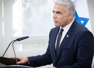 Lapid: ‘Without peace talks, 2022 will likely see Israel designated apartheid state’ Israeli Foreign Minister speaks during a faction meeting at the Knesset, on Dec. 6, 2021. Photo by Oliver Fitoussi/Flash90.