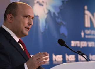 Bennett says Israel will build ‘laser wall’ defensive system within a year Israeli Prime Minister Naftali Bennett addressing the INSS conference. Feb, 1, 2022. Credit: Haim Zach/GPO