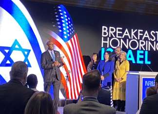 Enlisting Christian media in fight against anti-Semitism Pastor Lyndon Allen sings “Hatikvah” at the Breakfast Honoring Israel at the National Religious Broadcasters convention in Nashville on March 10, 2022. Credit: Larry Brook/Israel InSight.