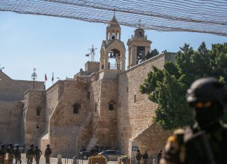 Biden meets with Palestinian Authority head Abbas in Bethlehem Palestinian Authority security forces guard outside the Church of Nativity in Bethlehem on July 14, 2022, before the visit of U.S. President Joe Biden on July 15, 2022. Photo by Flash90.