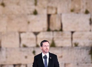 Herzog: Comparing Israel to apartheid South Africa is a ‘blood libel’ Israeli President Isaac Herzog at the Western Wall, speaking on the annual Remembrance Day for the Fallen of Israel's Wars and Victims of Terrorism, May 3, 2022. Credit: Kobi Gideon, GPO.