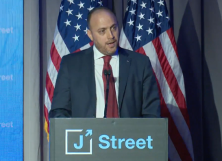 Palestinian envoy to UK refuses to condemn terrorist killing of seven Israelis The PLO's envoy to Britain Husam Zomlot, then ambassador to the U.S., speaks at J Street's national conference in Washington, April 16, 2018. Source: Screenshot.