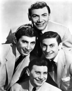 A 1955 publicity photo of the singing quartet the Ames Brothers; Ed Ames is at the top. Credit: Wikipedia.