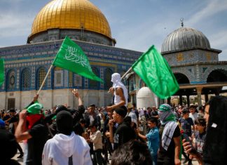 Palestinians’ preferred candidates: Genocidal terrorists Muslims wave Hamas flags after Friday prayers during Ramadan, on the Temple Mount in Jerusalem, April 22, 2022. Photo by Jamal Awad/Flash90.