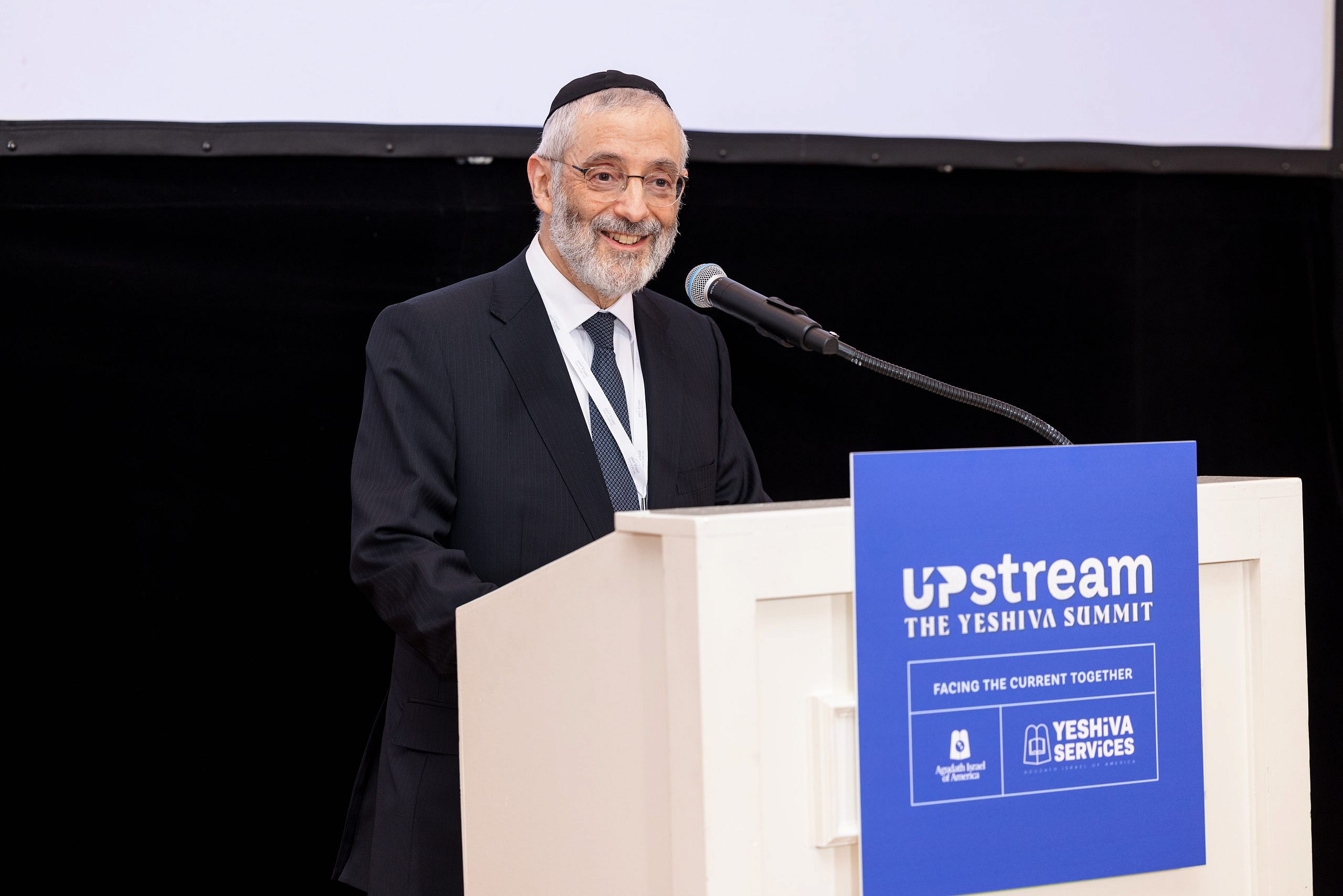 Chaim Dovid Zwiebel, executive vice president of Agudath Israel of America, speaks at the organization’s 2023 Yeshiva Summit. Credit: Moshe Gershbaum/Agudah.