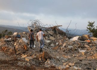 Demolition of terrorists’ homes all but stopped in 2023 Palestinians inspect the home of terrorist Muhammad Dar Yusuf in Kobar, Samaria, which the IDF demolished on Aug. 28, 2018. Dar Yusuf murdered 31-year-old Yotam Ovadia in the town of Adam. Credit: Flash90.