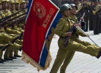 Anniversary of a forever war North Korean soldiers at the military parade in Pyongyang of the 60th anniversary of the conclusion of the Korean War. Pyongyang, North Korea. Circa July 2013. Credit: Astrelok/Shutterstock.
