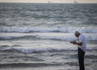 Tashlich is more than a spiritual, Marie Kondo purge, experts say Performing Tashlich overlooking the beach in Kiryat Yam, a suburb outside of Haifa, on Sept. 30, 2019. Photo by Hadas Parush/Flash90.