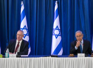 Netanyahu, Gantz agree on unity government Prime Minister Benjamin Netanyahu and then-Defense Minister Benny Gantz at the weekly Cabinet meeting in Jerusalem, June 28, 2020. Photo by Olivier Fitoussi/Flash90.
