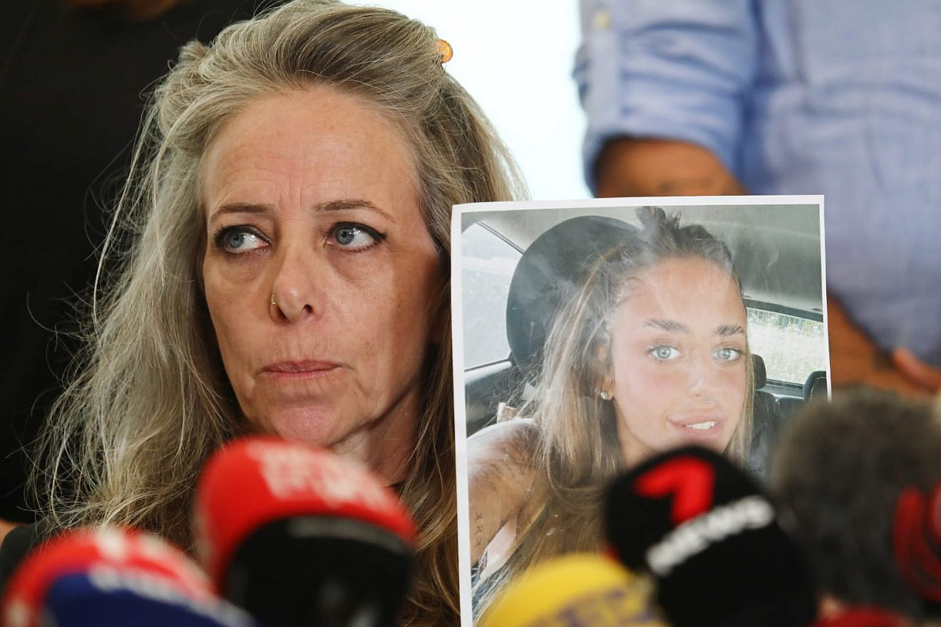 Keren Shem holds a photo of her daughter Mia, who is being held hostage in the Gaza Strip, at a press conference in Tel Aviv, Oct. 17, 2023. Photo by Gideon Markowicz/TPS.