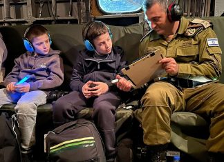 Experts remain divided over hostage deal An Israeli soldier shares exchanges in an Israeli Air Force helicopter with Tal, 9, and Gal Goldstein, 11, of Kfar Aza (their mother, Chen Goldstein, 48, and sister, Agam Goldstein, 17, were also released), on their return to Israel from Hamas captivity in the Gaza Strip, Nov. 26, 2023. Credit: Courtesy of the IDF Spokesperson.