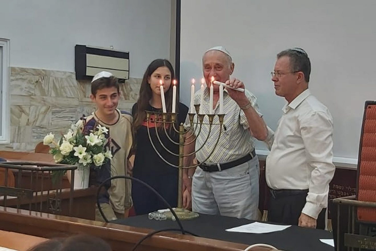 Moshe Ridler and two of his grandchildren at a memorial for Romanian Jews three years ago. Credit: Courtesy. 