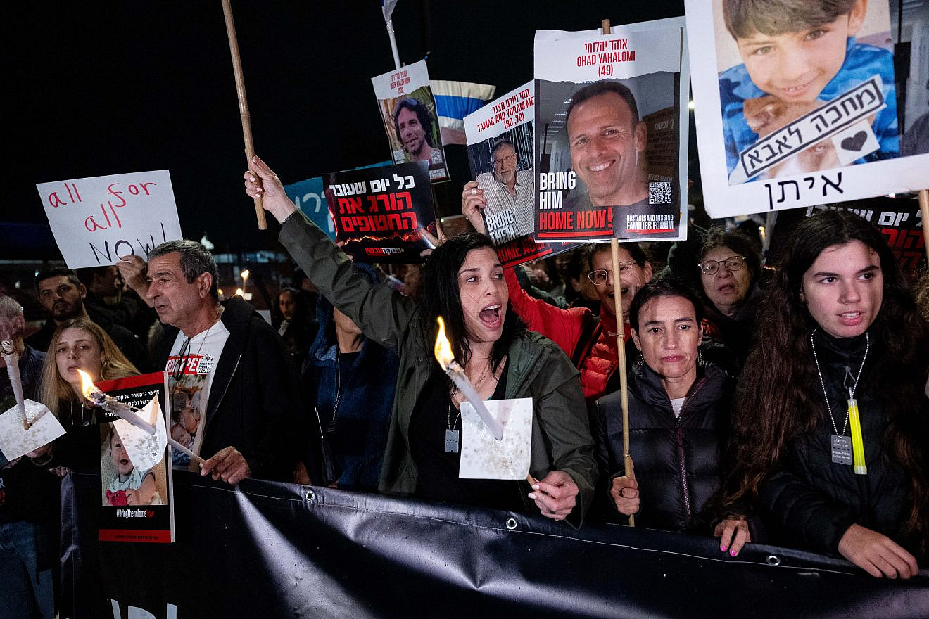 Israelis and families of Israelis held hostage by Hamas terrorists in Gaza, hold torches as they towards the Israeli parliament, on the fifth night of the Jewish holiday of Chanukah, as they call for the release of the hostages. Dec. 12, 2023. Photo by Yonatan Sindel/Flash90.