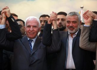 Hamas in secret talks with Fatah about post-war alliance Senior Fatah official Azzam al-Ahmed (left) and Hamas leader Ismail Haniyeh announce a reconciliation agreement between the terrorist factions in Gaza City, April 23, 2014. Photo by Abed Rahim Khatib/Flash90.
