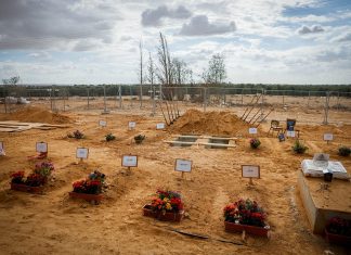Earn the right to say ‘never again’ Graves of Kibbutz Be'eri residents who were murdered by Hamas terrorists on Oct. 7, 2023. Photo: Chaim Goldberg/Flash90