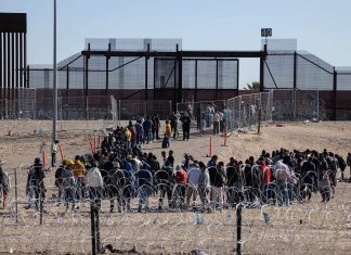 US aid to Israel is vital, but so is addressing the border crisis Migrants, mainly from Venezuela, gather at the Mexico-U.S. border, seeking asylum before Title 42 ends, May 13, 2023. Credit: David Peinado Romero/Shutterstock.